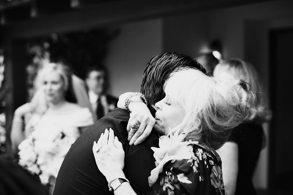 Son and Mother Hugging at Wedding