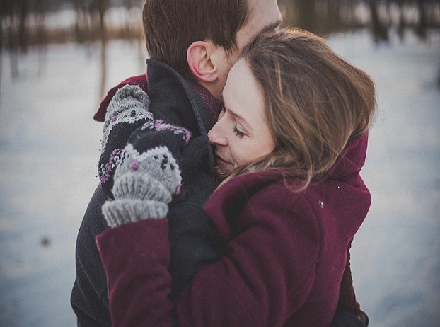Lovers share a hug in winter