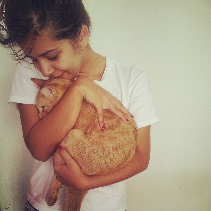 Lady Hugging Orange Cat